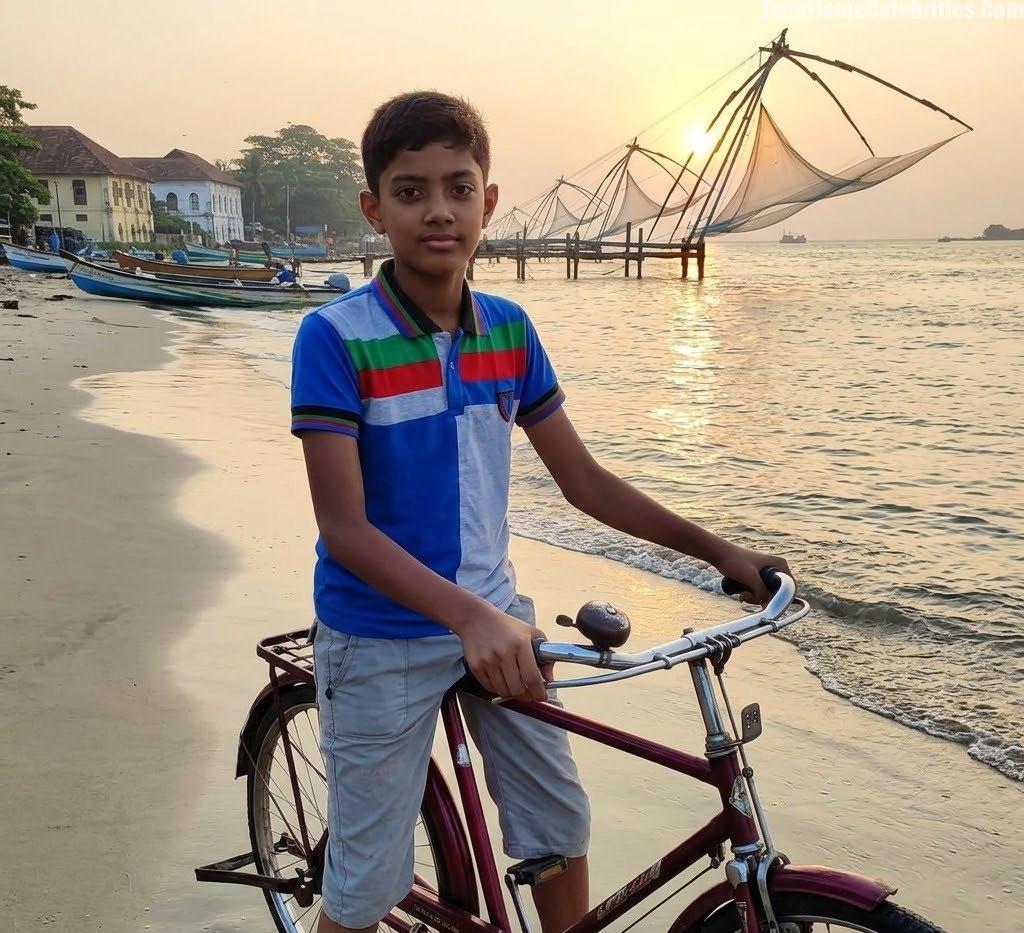 Manu with his bicycle on Fort Kochi Beach