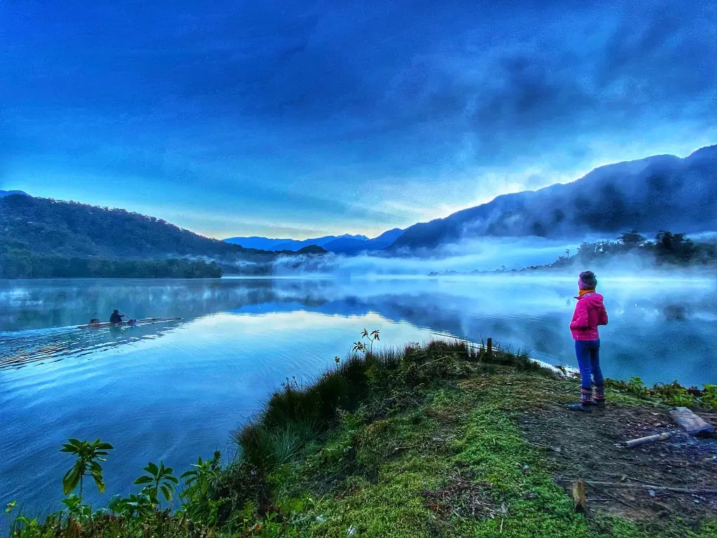 Kerala river in summer vacation with misty hills and calm water hiding dangers for children – water safety awareness