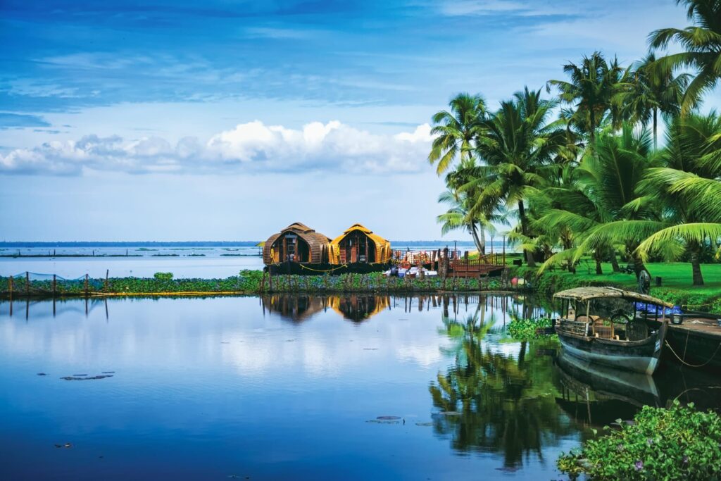 Peaceful Kerala backwaters in summer with houseboats and palm trees – representing inviting yet dangerous waters for kids