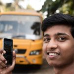 College student in Ernakulam waiting for a secure school bus.