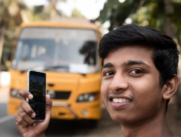 College student in Ernakulam waiting for a secure school bus.